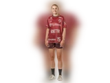 En kvinde i en rødbrun sportsdragt med påskriften »SydBank« og nummeret 15 står og smiler foran en hvid baggrund.