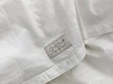 Nuku baby sengetøj i offwhite fra OYOY
