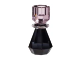En facetteret, geometrisk parfumeflaske med sort bund, en klar ring i midten og en lyserød, ædelstenslignende hætte.