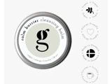 En rund metalbeholder med Calm Barrier Cleansing Balm, ledsaget af fire cirkulære ikoner, der angiver, at produktet er vegansk, allergivenligt, fremstillet i Danmark og cirkulært.