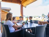 Familieferie for 6 i norsk bjælkehytte på Jambo Feriepark - minigolf, is og Fårup Sommerland tæt på
