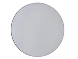 Et rundt, almindeligt, rammeløst spejl med en glat overflade, fotograferet mod en hvid baggrund.