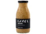 En glasflaske med Nicolas Vahé GOMA-dressing med sort etiket og sort låg, der indeholder en cremet, spættet lysebrun sauce.