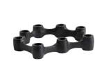 En sort, cirkulær gummikobling med seks huller og hævede forbindelsespunkter, placeret på en hvid baggrund.