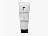 En hvid tube mærket grums raw espresso face scrub + mask med en sort hætte, med små prikkede mønstre og minimalistisk design.