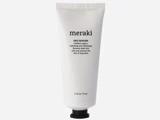 En hvid tube med Meraki Face Exfoliate med sort tekst, der indeholder 75 ml (2,5 fl oz). Hætten er sort, og tuben står lodret.