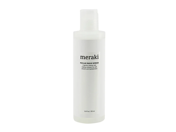 En hvid flaske med Meraki Micellar Makeup Remover med sort tekst på etiketten, der står oprejst mod en almindelig hvid baggrund.