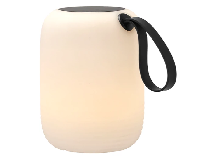 En moderne, cylindrisk hvid transportabel lampe med sort top og et sort håndtag på den ene side.