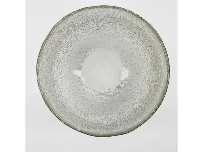 En rund, klar, struktureret glasskål set ovenfra med en let uregelmæssig kant og et spættet mønster hele vejen igennem.