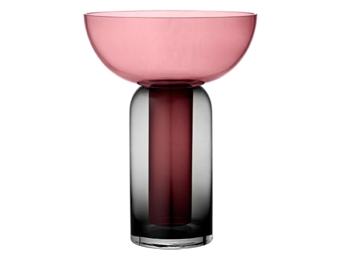 En moderne dekorativ glasvase med en bred, lav lyserød skål oven på en høj, cylindrisk mørkegrå base på en hvid baggrund.