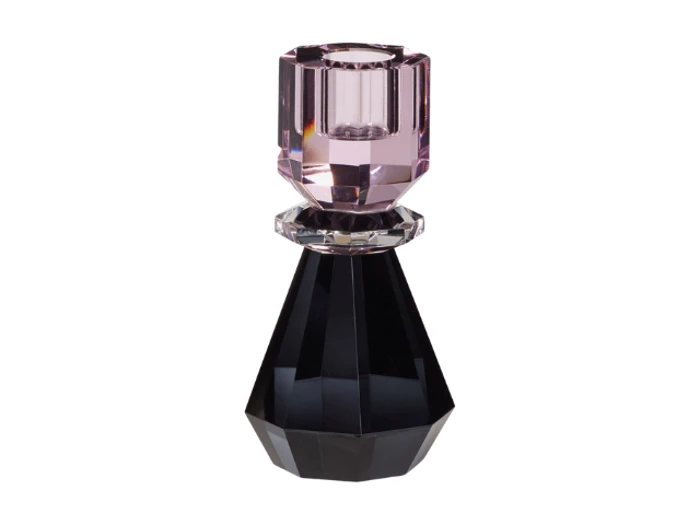 En facetteret, geometrisk parfumeflaske med sort bund, en klar ring i midten og en lyserød, ædelstenslignende hætte.