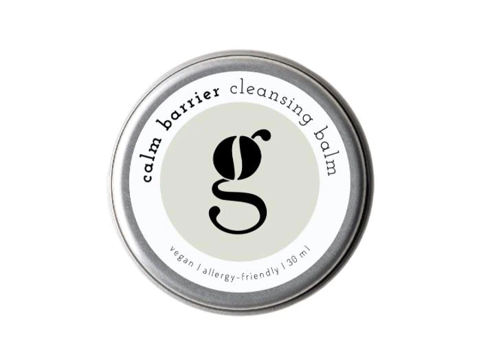 En rund dåse med Calm Barrier Cleansing Balm med et tydeligt g-logo i små bogstaver og teksten vegan | allergivenlig | 30 ml.