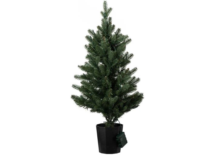 Et lille kunstigt juletræ i en sort krukke med et batterisæt monteret.