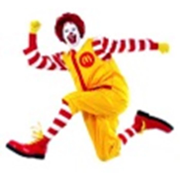 En klovn i en gul jumpsuit med rød- og hvidstribede ærmer og sokker hopper med den ene arm i vejret, iført røde sko og en rød paryk.