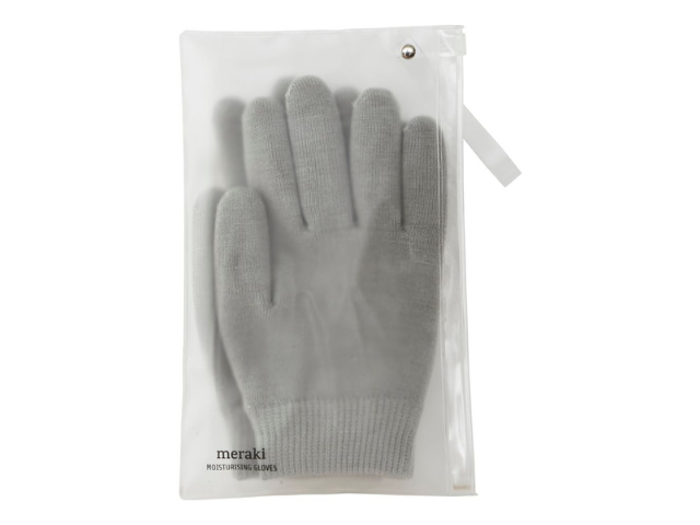 Et par grå fugtighedshandsker i en gennemsigtig lynlåspose med en hvid etiket, hvor der står meraki MOISTURIZING GLOVES.