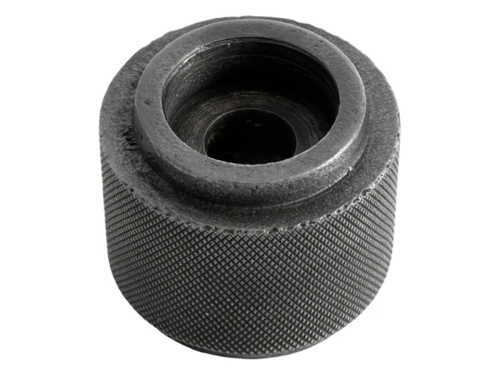 Et sort, rundt objekt med et hul.