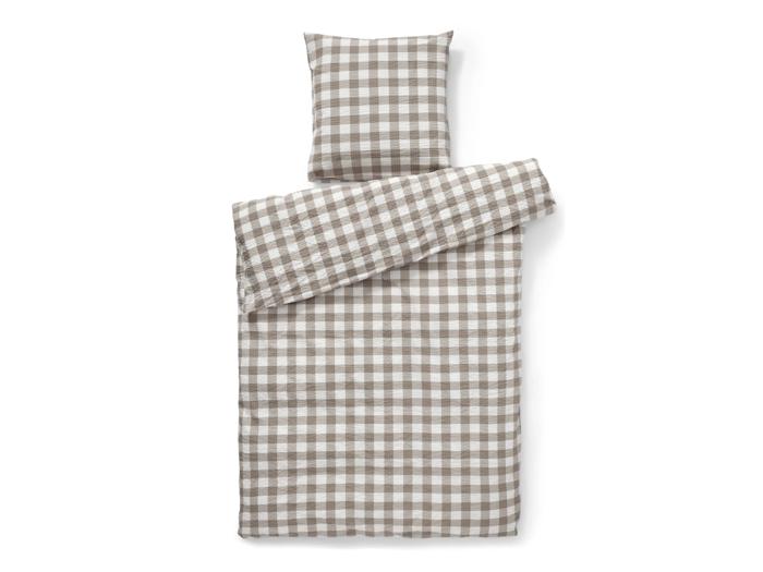 Sengetøjssæt med dynebetræk og pudebetræk i et gråt og hvidt gingham-mønster.