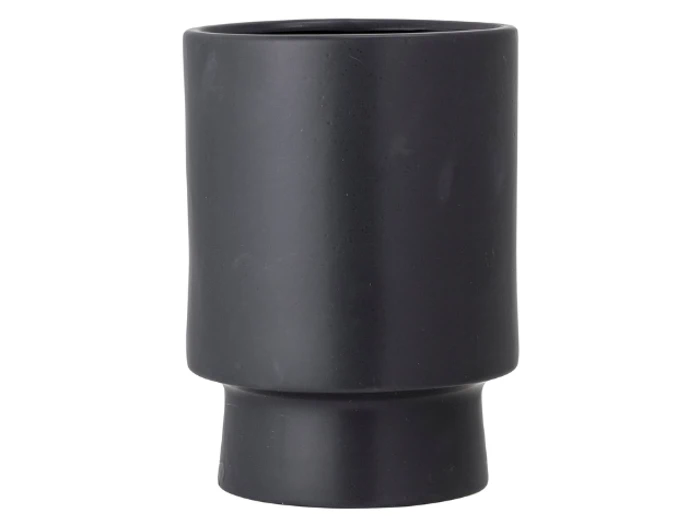 Et matsort keramikglas med en glat finish, lidt bredere i toppen og smallere mod bunden.