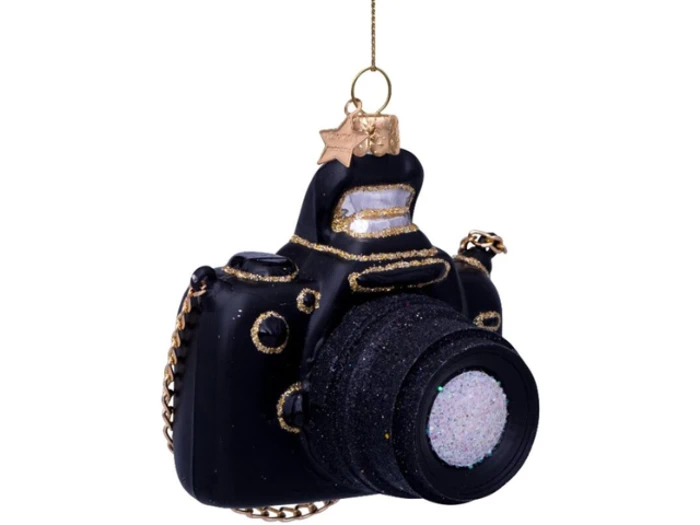 Et sort kameraformet ornament med gulddetaljer og glitter, der hænger i en guldsnor med en lille guldstjerne på.