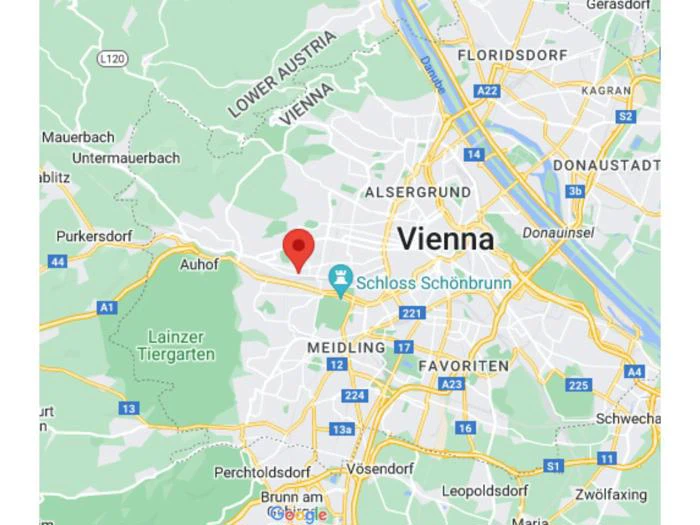Kort over Wien, Østrig, der viser veje og kvarterer, med en rød lokationsnål vest for byens centrum, nær Schloss Schönbrunn og Lainzer Tiergarten.
