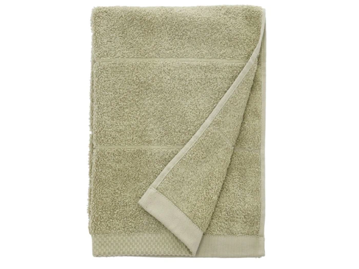 Et pænt foldet lysbeige håndklæde med et synligt hjørne vendt om, vist på en hvid baggrund.