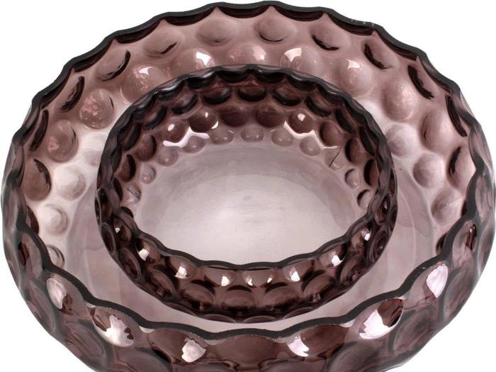 To lilla glasskåle med boblemønster, den ene indlejret i den anden, set ovenfra.